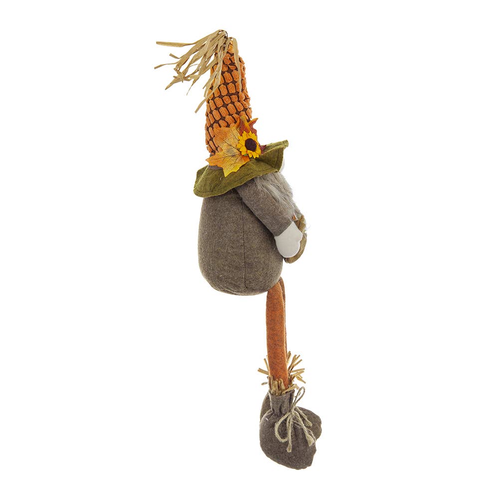 Opposite side view of the Harvest Scarecrow Gnome Plush with sunflower and leaf hat accents, gray-brown body, and twine-tied boots
