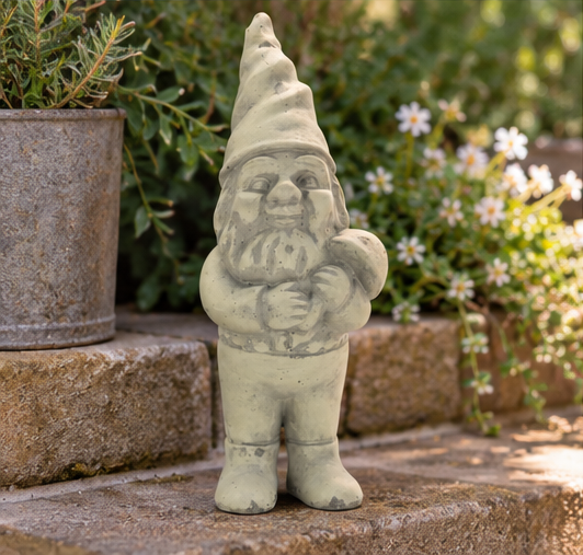 Gray cement Clifford garden gnome holding a mushroom on stone steps beside potted plants and flowers