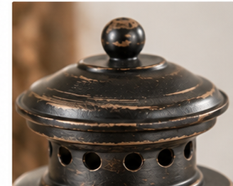 Distressed black lantern top with round finial and circular ventilation holes