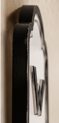 Side view of the Wash metal laundry sign showing its depth and raised lettering
