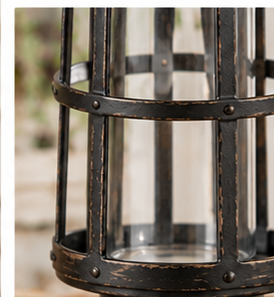 Clear glass chimney inside the Curtis Island lantern’s riveted black metal frame