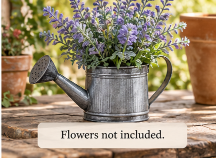 Mini metal watering can styled with purple flowers and greenery, with flowers not included