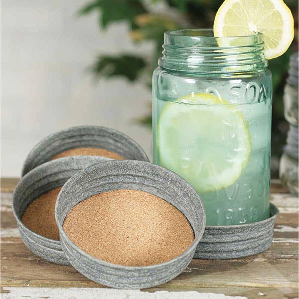 Stop & Smell the Rosé mason jar lid coaster set displayed on a table – 4 cork-lined coasters with charming rosé-inspired print, arrives gift-ready with jute ribbon tie