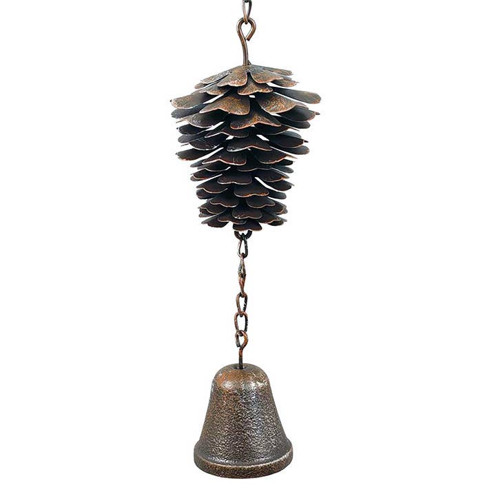 Brown-bronze metal pine cone wind chime with a hanging bell on a white background.