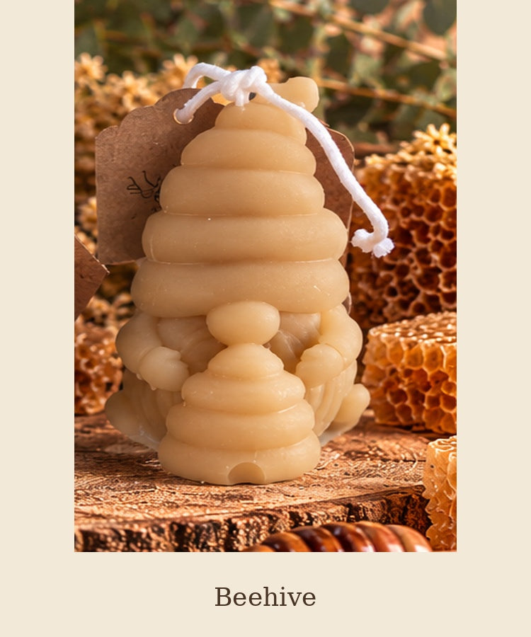 Beeswax gnome candle with a ribbed hat holding a beehive, labeled Beehive