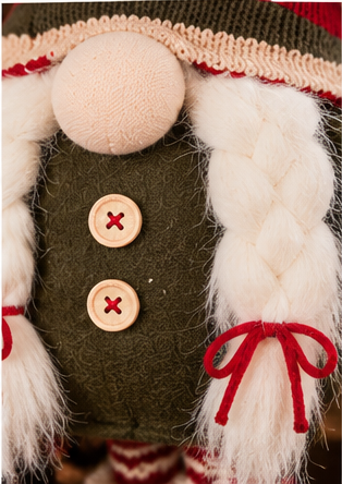 Close-up of the Christmas gnome’s braided white beard with red bows and green outfit with cream buttons