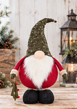 Tree Gift Christmas gnome with retracted legs, a green dotted hat, red outfit, and hanging tree ornament on rustic wood