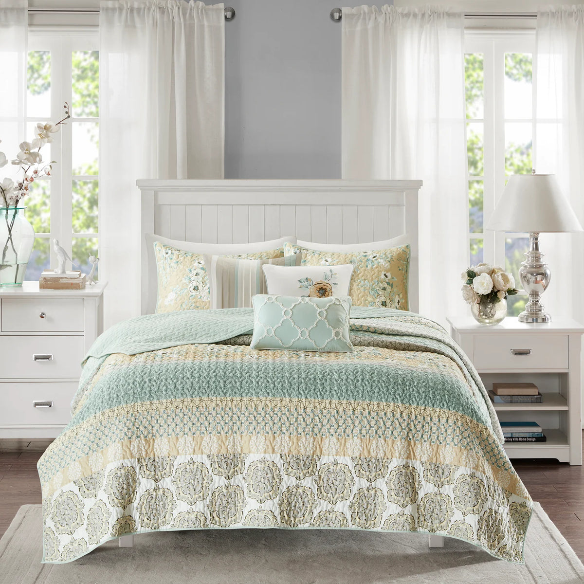 Three coordinating Madison Park decorative pillows featuring cream pleats, floral embroidery, and an aqua geometric design.