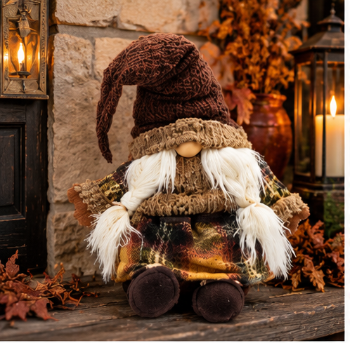 Rustic Harvest Gnome Plush beside a stone hearth with glowing lanterns and autumn leaves