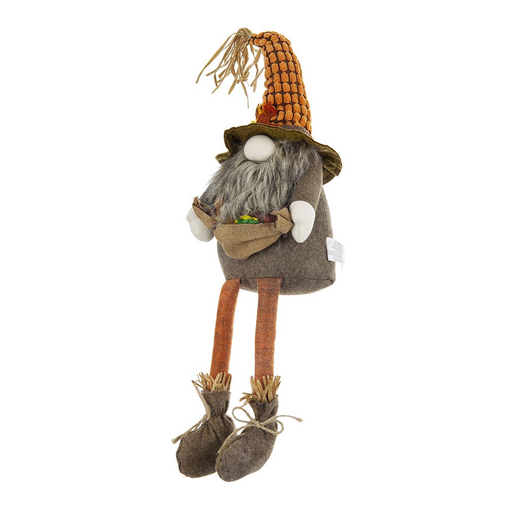Three-quarter view of the Harvest Scarecrow Gnome Plush with a corn-textured hat, gray beard, orange legs, and twine-tied boots