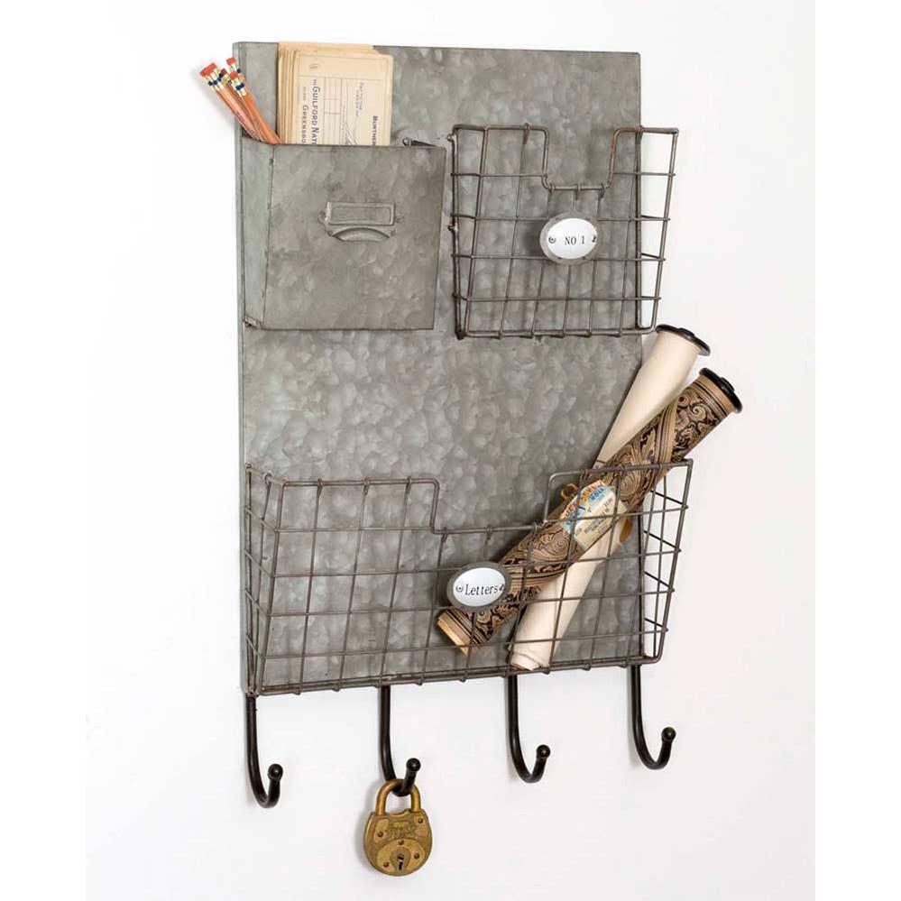 Rustic three-pocket wall caddy with four hooks, styled with letters, pencils, rolled papers, and a padlock

