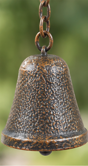 Close-up of the textured bronze-tone bell and chain on a pine cone wind chime.