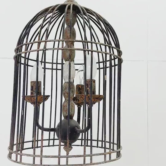Rustic metal bird cage pendant lamp with distressed finish and candelabra bulb holders, hanging by chain video view