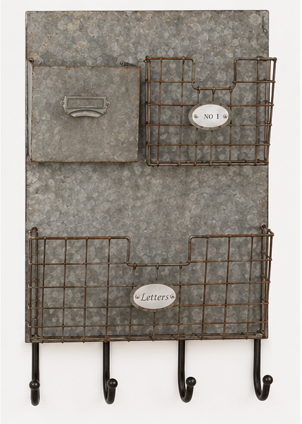 Empty rustic metal wall mail organizer with one solid pocket, two wire baskets, and four hooks
